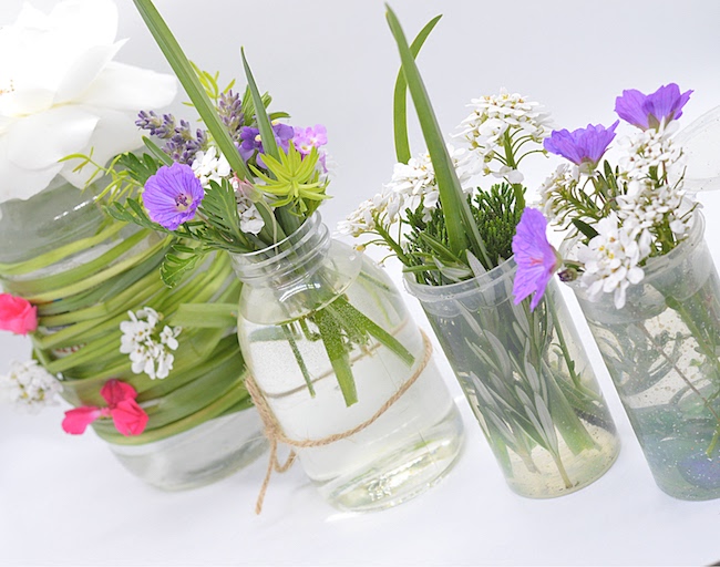 Nature Play for Kids: Kid made mini flower vases with flowers from the backyard